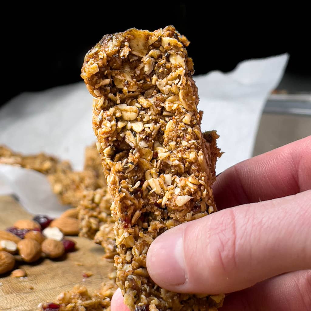 Granola Bar being held by a hand