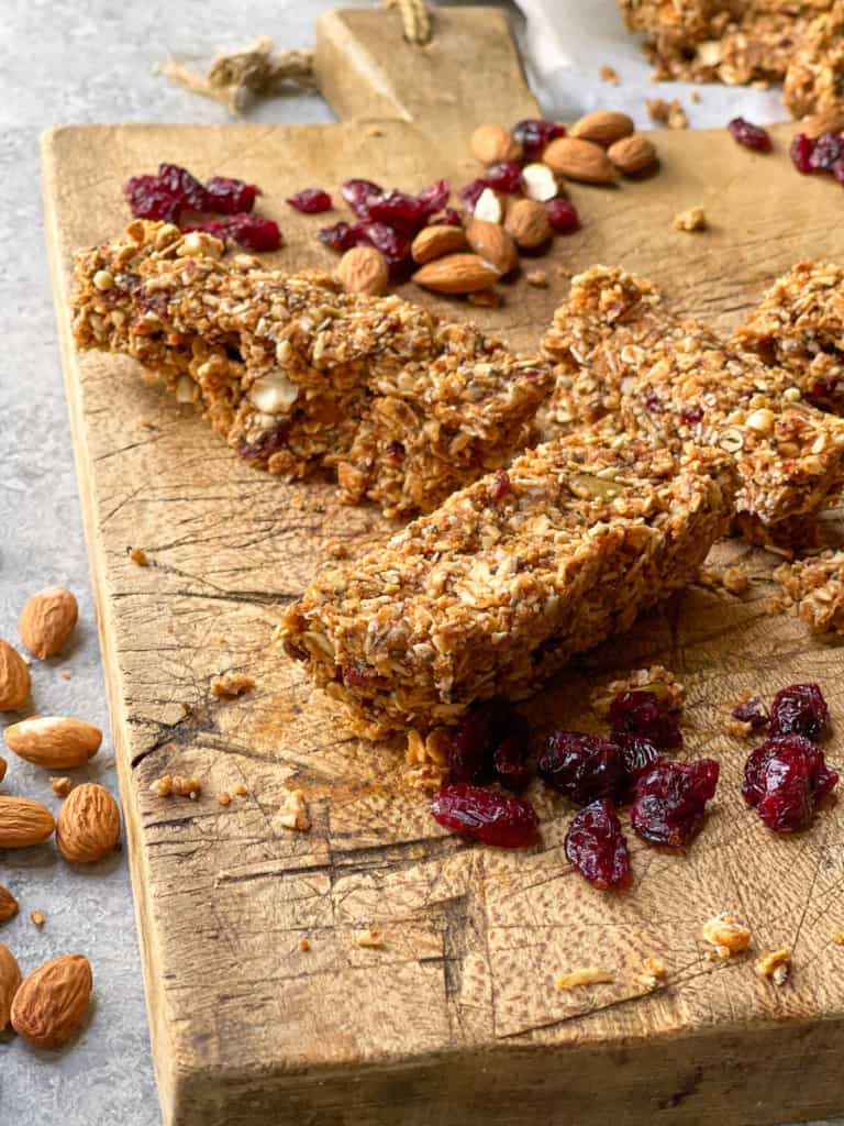 Granola bars with drizzled chocolate on a serving board