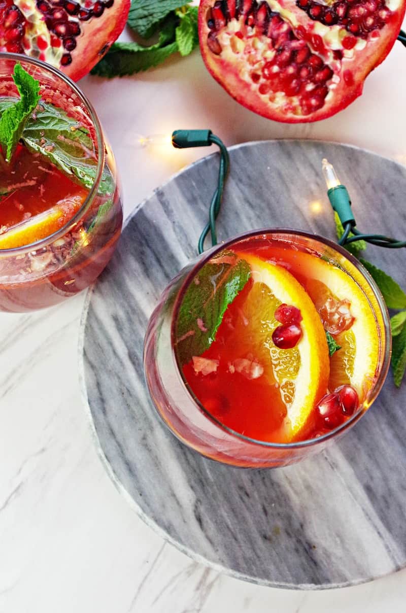 Pomegranate Orange Holiday Punch- The perfect easy New Year's drink recipe to reign in 2017! Juicy pomegranate meets kombucha with a bright citrus flavor for the best holiday bubbly! And Whole30 compliant!|thekitcheneer.com