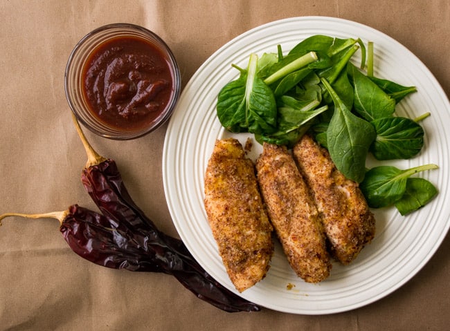 Oven Fried Chipotle Chicken Tenders-Feed your inner child with these chicken tenders coated in a kickin spicy sauce and on your table in 30 minutes or less!