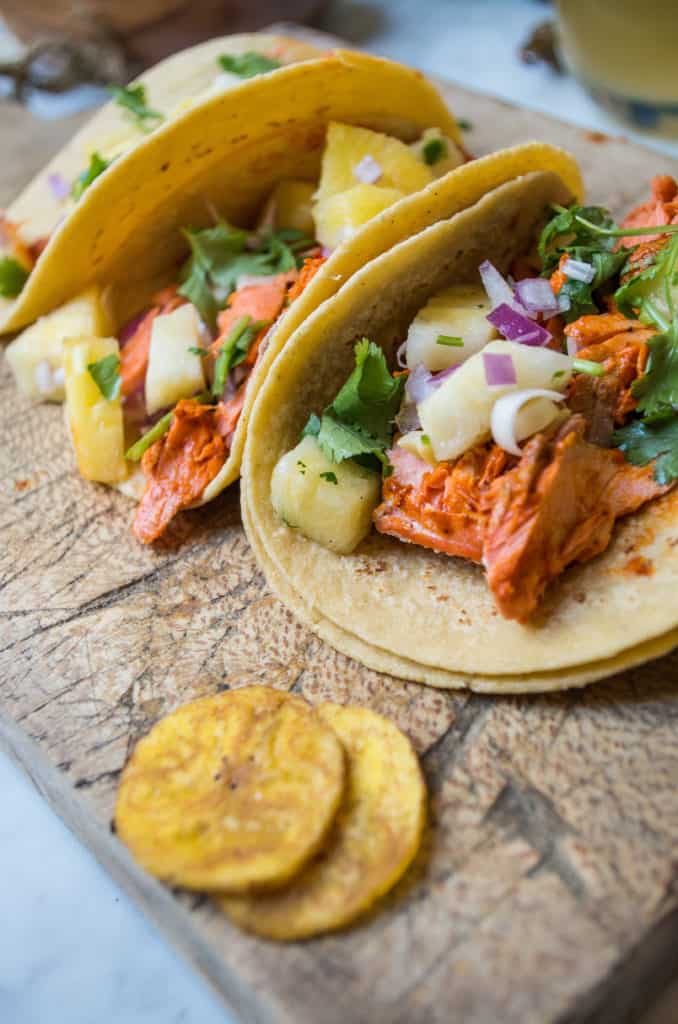 Fish Tacos Al Pastor- these ar SO easy and mind blowingly delicious. Simply blend the marinade add fish of choice plus a quick pineapple salsa to add even more flavor. #glutenfree #dairyfree #cincodemayo #tacotuesday