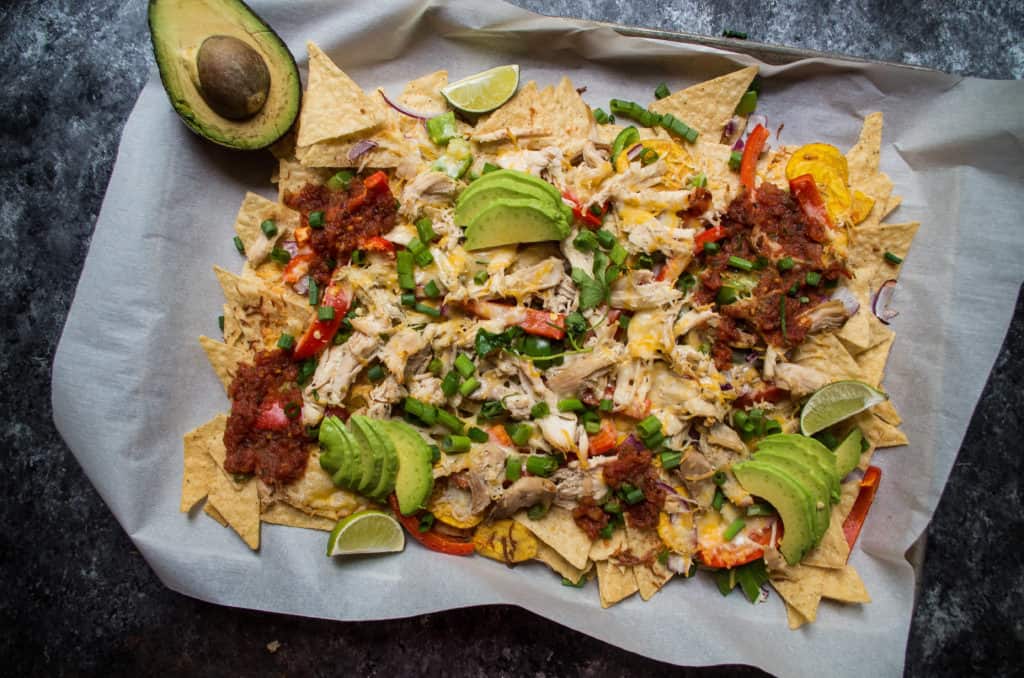 Made with shredded rotisserie chicken with roasted peppers and onions over a bed of grain free tortilla chips. This sheet pan meal couldn’t be easier or healthier than getting nachos at a restaurant or at the ball park. Bonus? It’s healthy AND done in less than 20 minutes!
