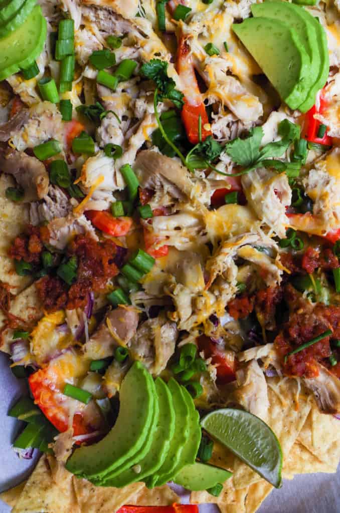 Made with shredded rotisserie chicken with roasted peppers and onions over a bed of grain free tortilla chips. This sheet pan meal couldn’t be easier or healthier than getting nachos at a restaurant or at the ball park. Bonus? It’s healthy AND done in less than 20 minutes!