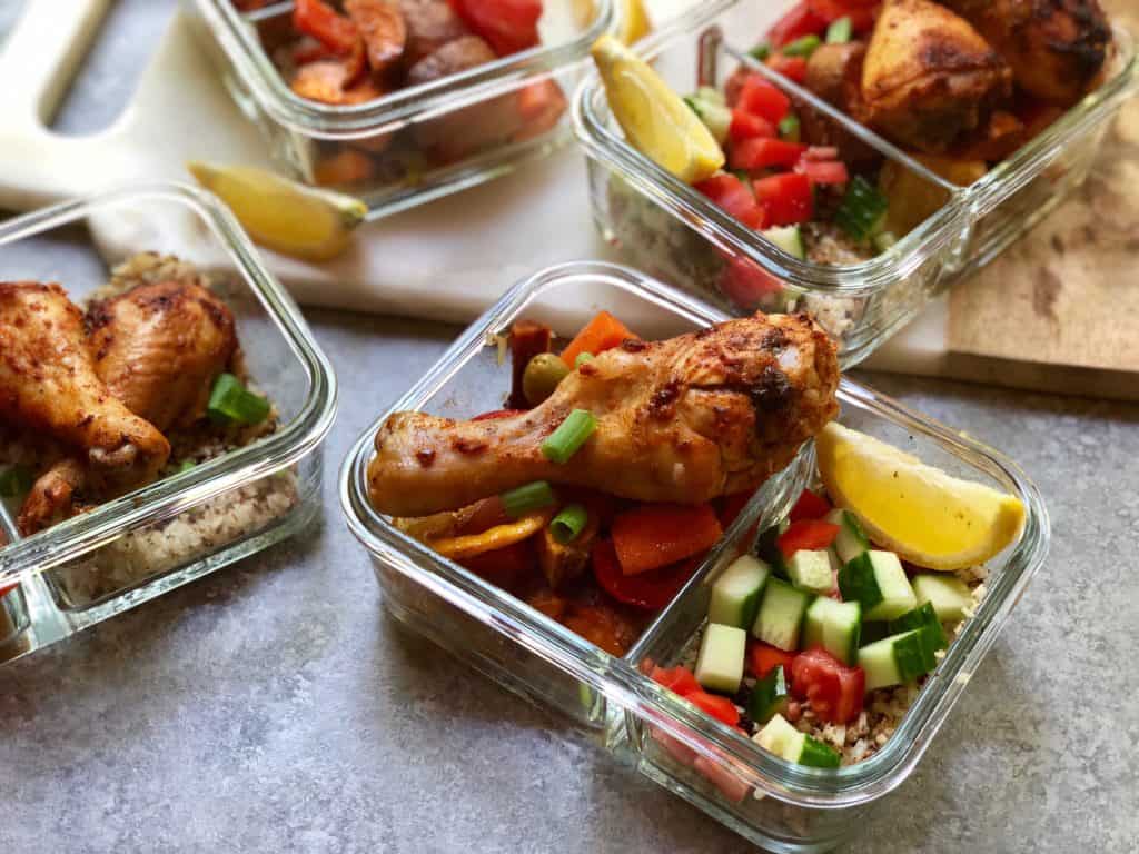 Moroccan Spiced Chicken Meal Prep bowls will be your no go to for this summer! Herb and harissa spiced chicken drum sticks with crispy roasted veggies all cooked at once for an easy way to meal prep lunches for the whole week so you can tackle your goals head on!