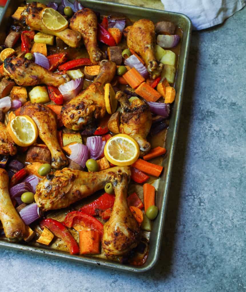 Moroccan Spiced Chicken Meal Prep bowls will be your no go to for this summer! Herb and harissa spiced chicken drum sticks with crispy roasted veggies all cooked at once for an easy way to meal prep lunches for the whole week so you can tackle your goals head on!