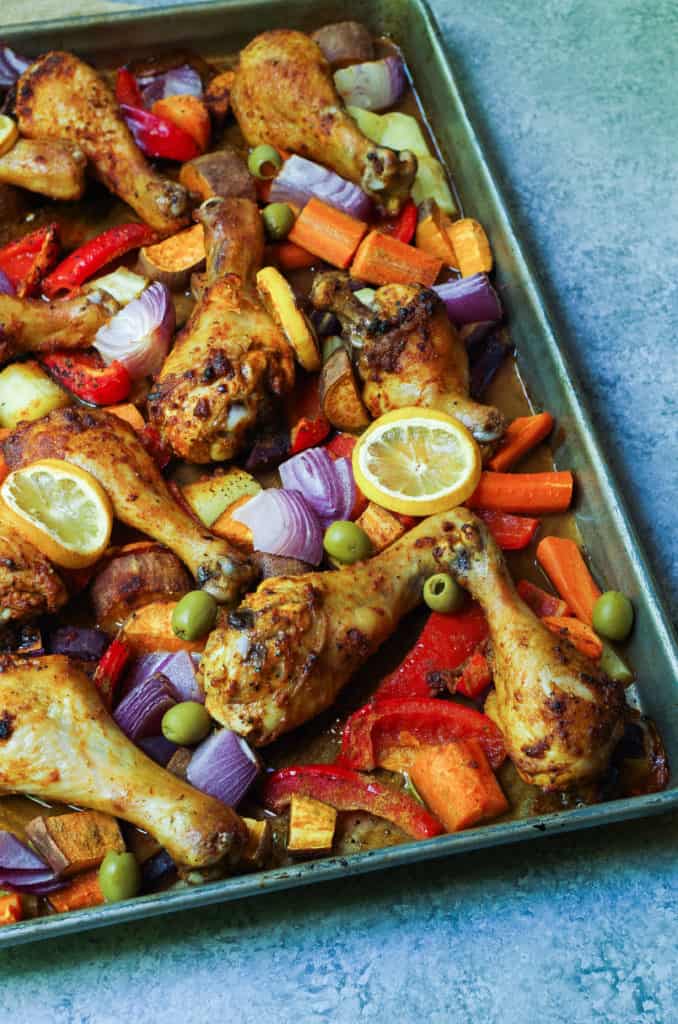 Moroccan Spiced Chicken Meal Prep bowls will be your no go to for this summer! Herb and harissa spiced chicken drum sticks with crispy roasted veggies all cooked at once for an easy way to meal prep lunches for the whole week so you can tackle your goals head on!