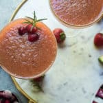 This Cranberry Strawberry Frose is a MUST for this summer’s cocktail sip. Cranberries and strawberries are combined into a simple syrup using coconut sugar then blended into an amazing frozen adult icee. Add a sprig of mint or rosemary to instantly up your drink game and add another level of flavor. I’m telling you EVERYONE needs this frose with a sprig of rosemary. It’s a GAME CHANGER.