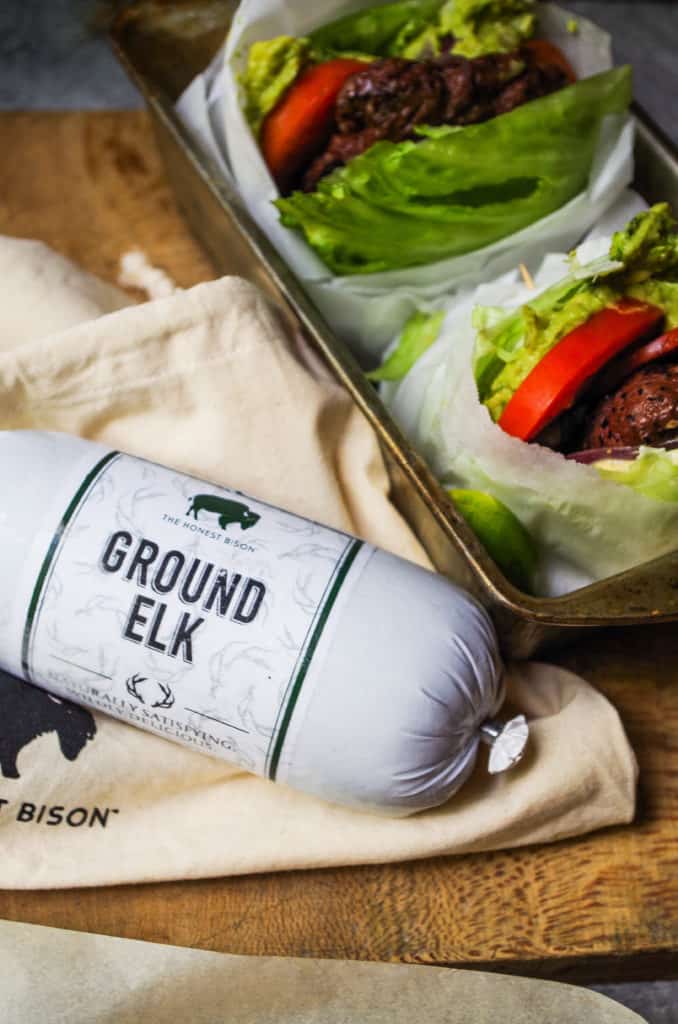 Tender, juicy, mouth-watering burgers. Topped with a dollop of a simple guacamole and wrapped in lettuce. These burgers make the perfect excuse to light up the grill this summer! Plot twist? These are elk burgers!!