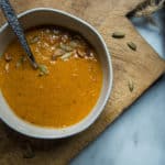 Creamy, delicious, HEARTY, AND vegetarian Whole30 pumpkin soup is here! And it has a secret ingredient that adds an unexpected depth of flavor: almond butter.