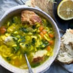 Chicken noodle soup in a bowl with a spoon