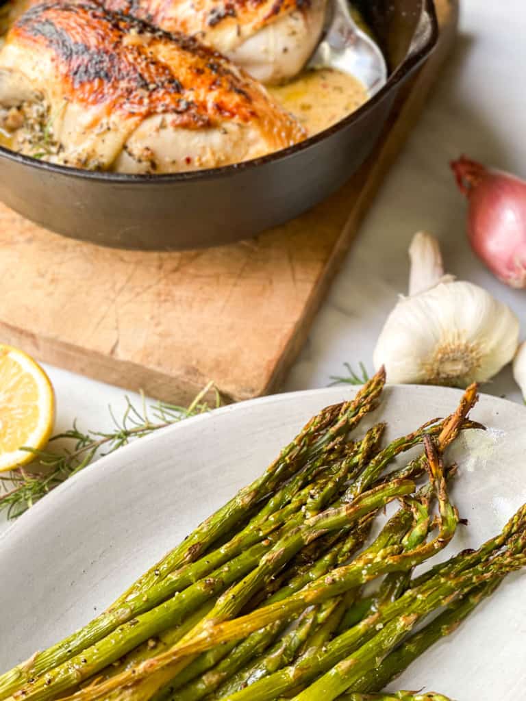 Seared Chicken Breasts in a Creamy Garlic Sauce in a cast iron skillet 