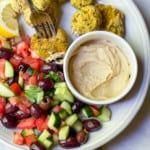 Falafels on a plate with a cucumber salad
