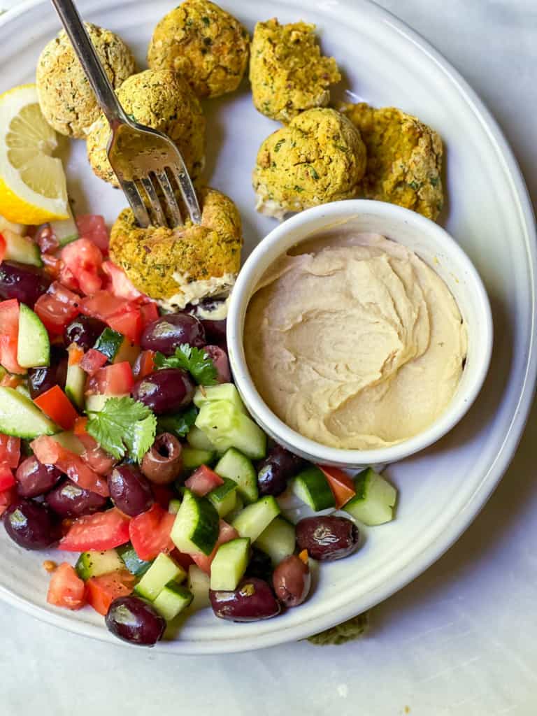 Falafels on a plate with a cucumber salad