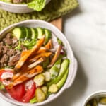 Burger salad in a large bowl with vegetables