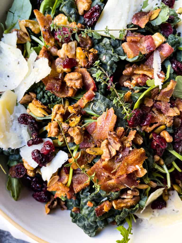 Big white serving bowl filled with a Kale Bacon Salad