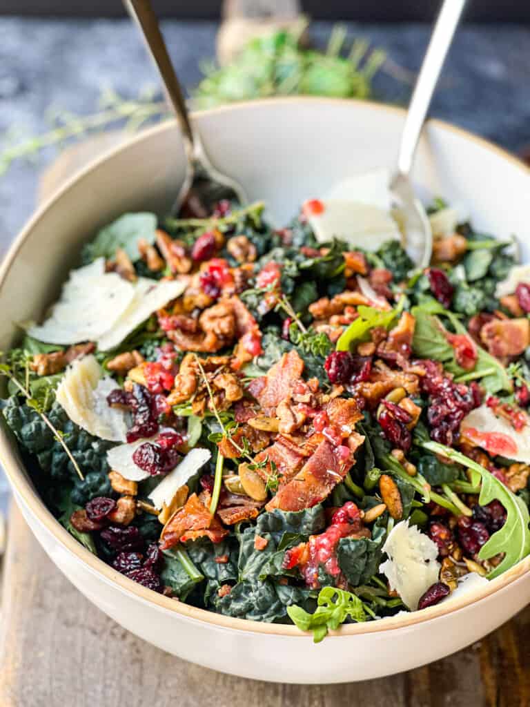 Big white serving bowl filled with a Kale Bacon Salad