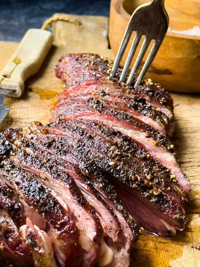 Smoked Tri-Tip sliced on a wooden cutting board 