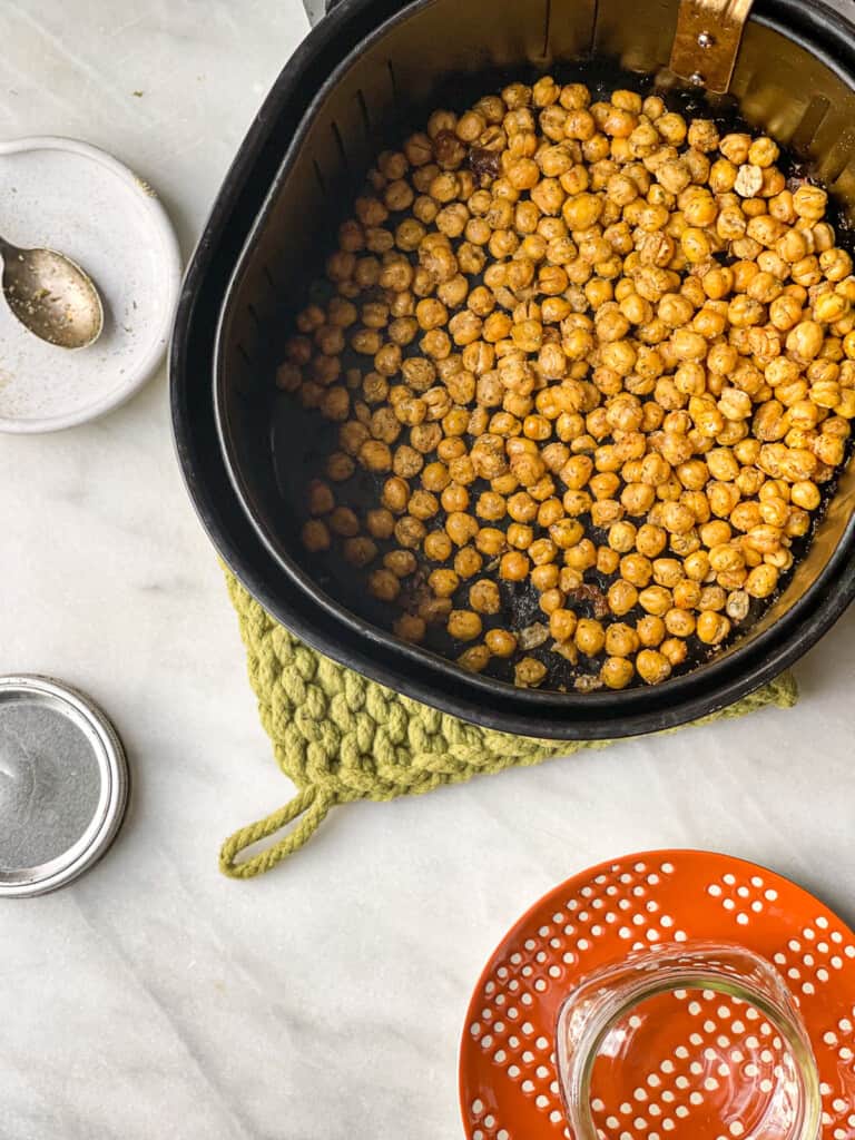 Crispy and Delicious Air Fryer Chickpeas in the air fryer basket 